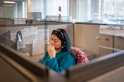Diversion navigator Mariela Benitez speaks on the phone with a potential client at Catholic Charities headquarters in Minneapolis. 



Hennepin County