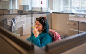 Diversion navigator Mariela Benitez speaks on the phone with a potential client at Catholic Charities headquarters in Minneapolis.
Hennepin County