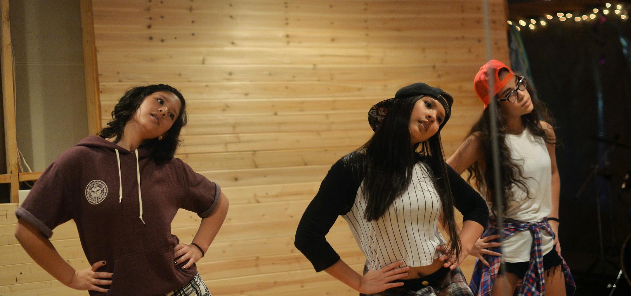 From left, Skylar Wolfe, 16, Addison Wolfe, 14, and Allison Quintana, 14, formed M2B Crew after meeting at a dance studio. They use a mirror to practice their moves.