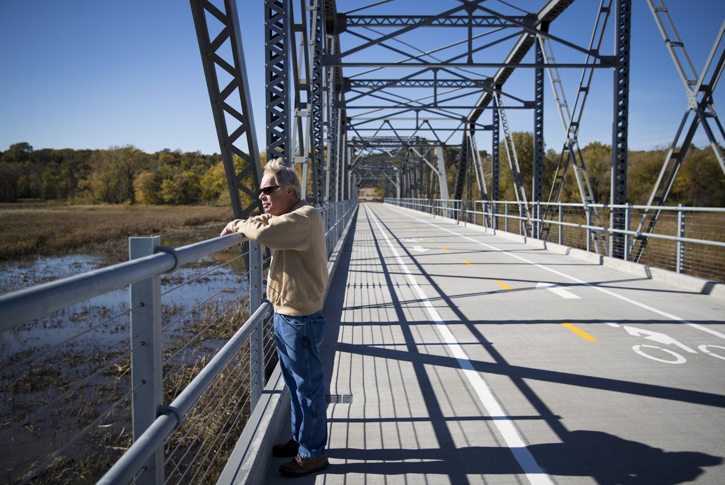 Marty Becker watched the birds in the water on the old Cedar Avenue bridge on Thursday, October 13, 2016, in Bloomington, Minn. Becker grew up fishing on the bridge when it was the main road over the Minnesota River. ] RENEE JONES SCHNEIDER &#x2022; renee.jones@startribune.com