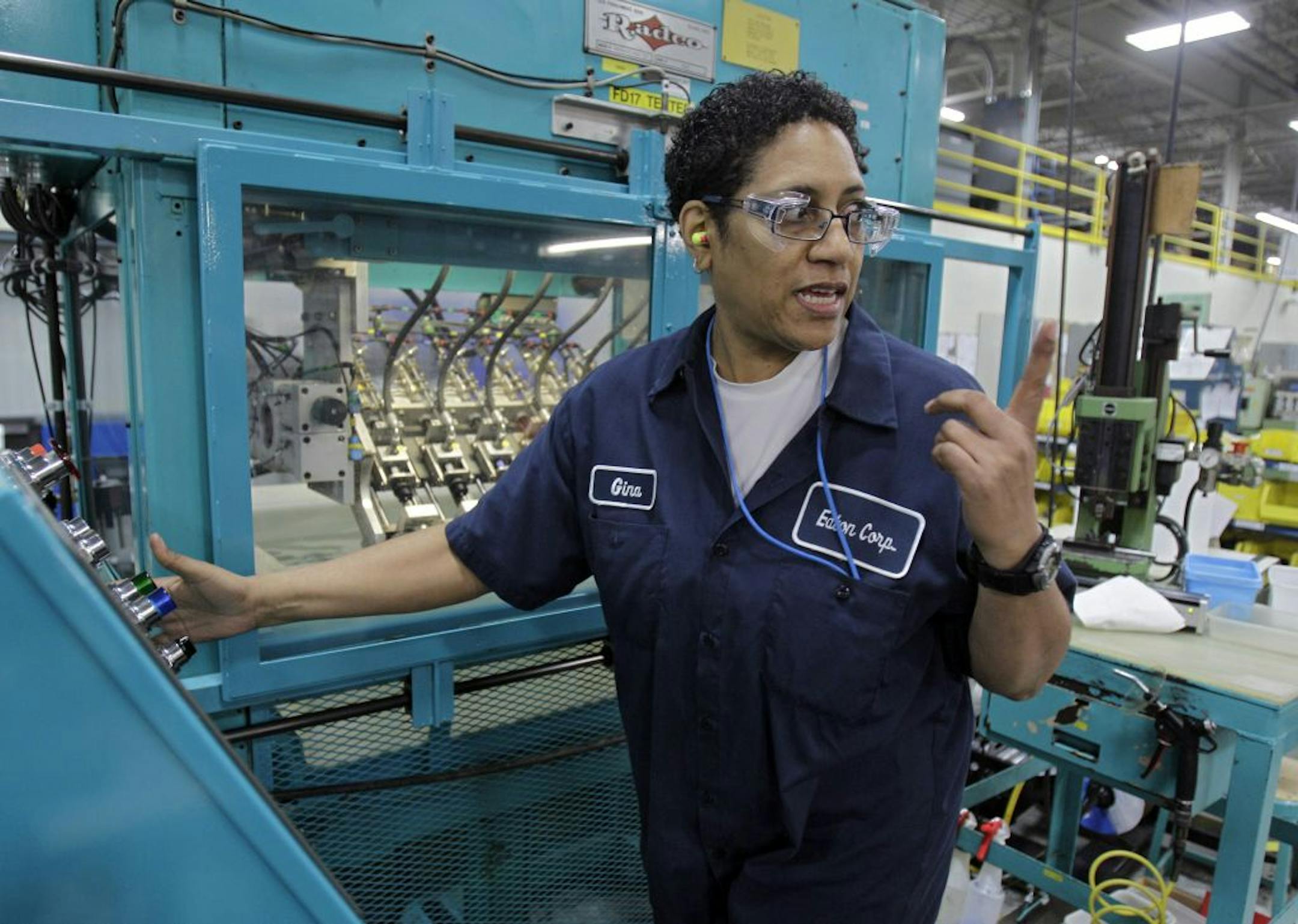 2012: Gina Johnson performs leak tests on hydraulic fittings at the Eaton Corp. plant in Berea, Ohio.