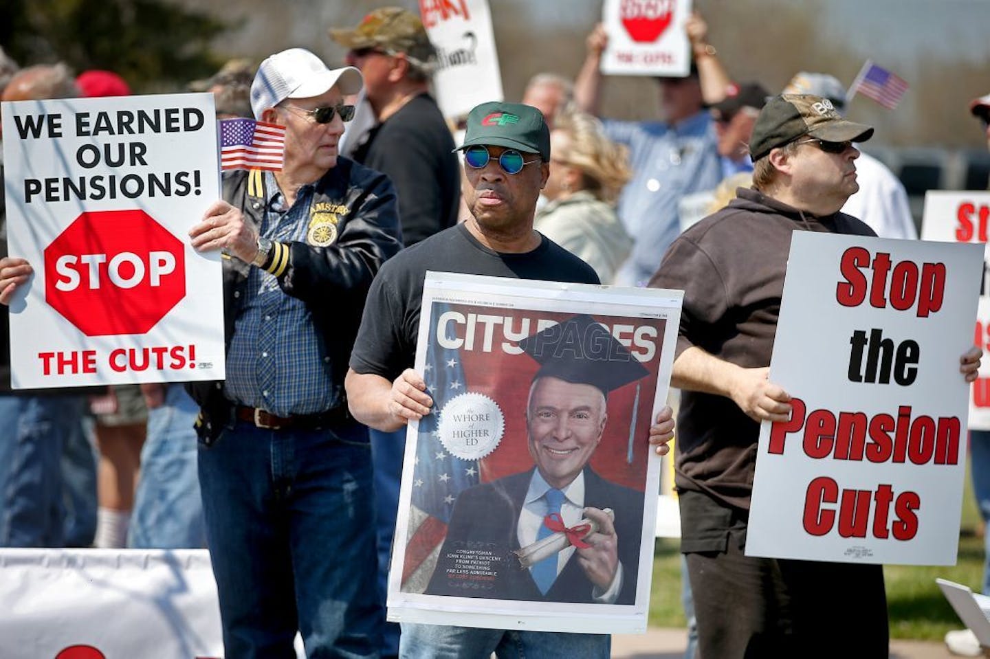 Ron Kretlow, left, who worked more than 25 years for a trucking company, Michael Trotter, center, who worked for 27 years at a freight company, and Larry Smith, right, who worked 38 years for a cement company, joined other Teamsters for a rally outside the offices of U.S. Rep. John Kline, Thursday, April 14, 2016, in Burnsville.