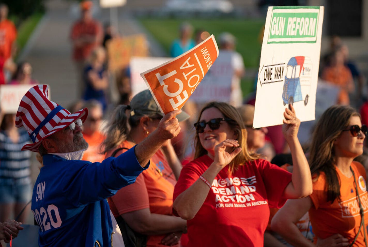 Attendees held signs up while listening to speakers at the rally. ] JEFF WHEELER • jeff.wheeler@startribune.com