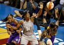 Minnesota Lynx center Sylvia Fowles (34) tried to block Los Angeles Sparks guard Odyssey Sims's (1) shot as she blocked Los Angeles Sparks forward Nne