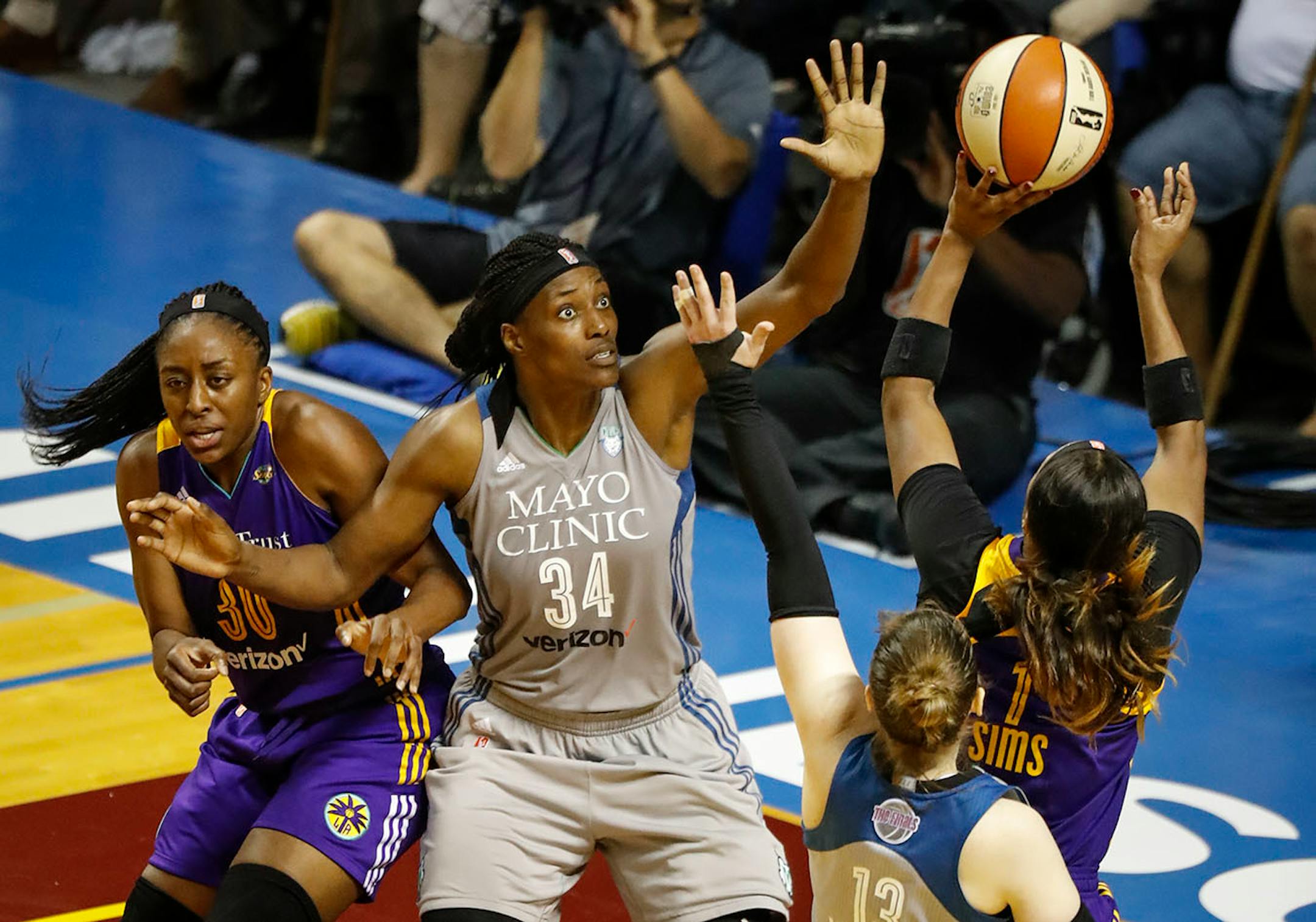 Minnesota Lynx center Sylvia Fowles (34) tried to block Los Angeles Sparks guard Odyssey Sims's (1) shot as she blocked Los Angeles Sparks forward Nneka Ogwumike (30) in the second half. The Sparks won 85-84.