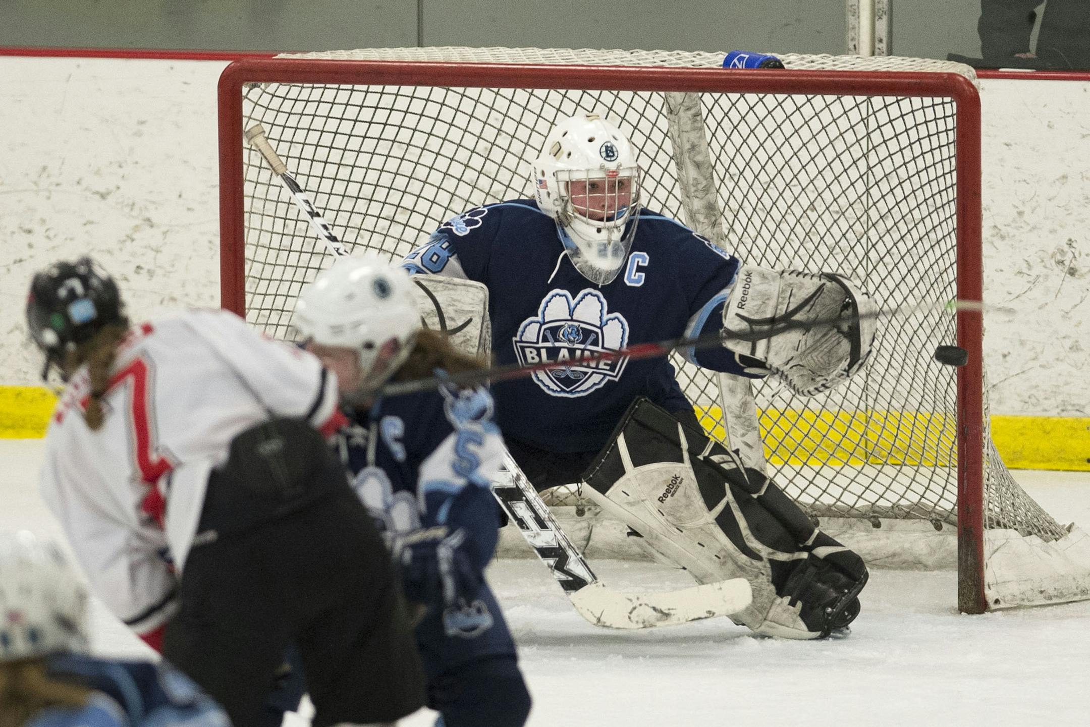 Blaine goalie Makayla Tilton (28) defends against a shot by Centennial in the second period. (Aaron Lavinsky, StarTribune)