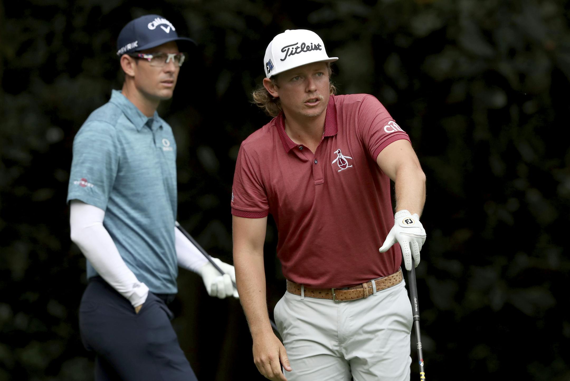 Cameron Smith, right, watches his tee shot as Dylan Frittelli prepares to hit on the seventh hole during the final round of the Masters golf tournament Sunday, Nov. 15, 2020, in Augusta, Ga. (Curtis Compton/Atlanta Journal-Constitution via AP)