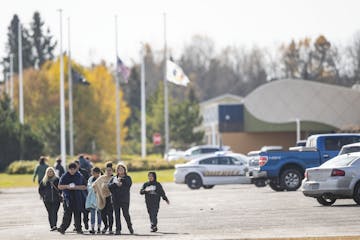 People walked away from the community center in Fond Du Lac after the lock down was lifted. The gymnasium inside is where a man was shot in the head o