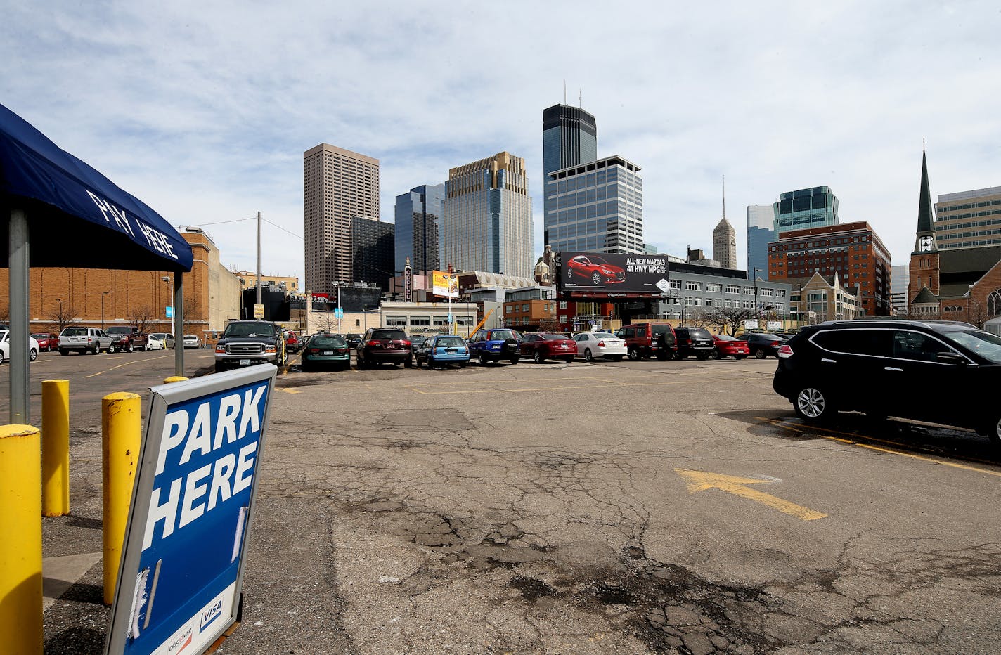 Surface parking at 1022 Hennepin Ave, Minneapolis, MN ] JOELKOYAMA&#x201a;&#xc4;&#xa2;jkoyama@startribune Minneapolis, MN on March 28, 2014. One of the most common and blighting elements of Minneapolis' urban core, surface parking lots, are about to face some extra scrutiny from City Hall. Council Member Jacob Frey, who represents half of downtown, is pushing for more enforcement of the city's landscaping ordinances for surface parking lots. Surface parking lots are the enemy of many a city plan