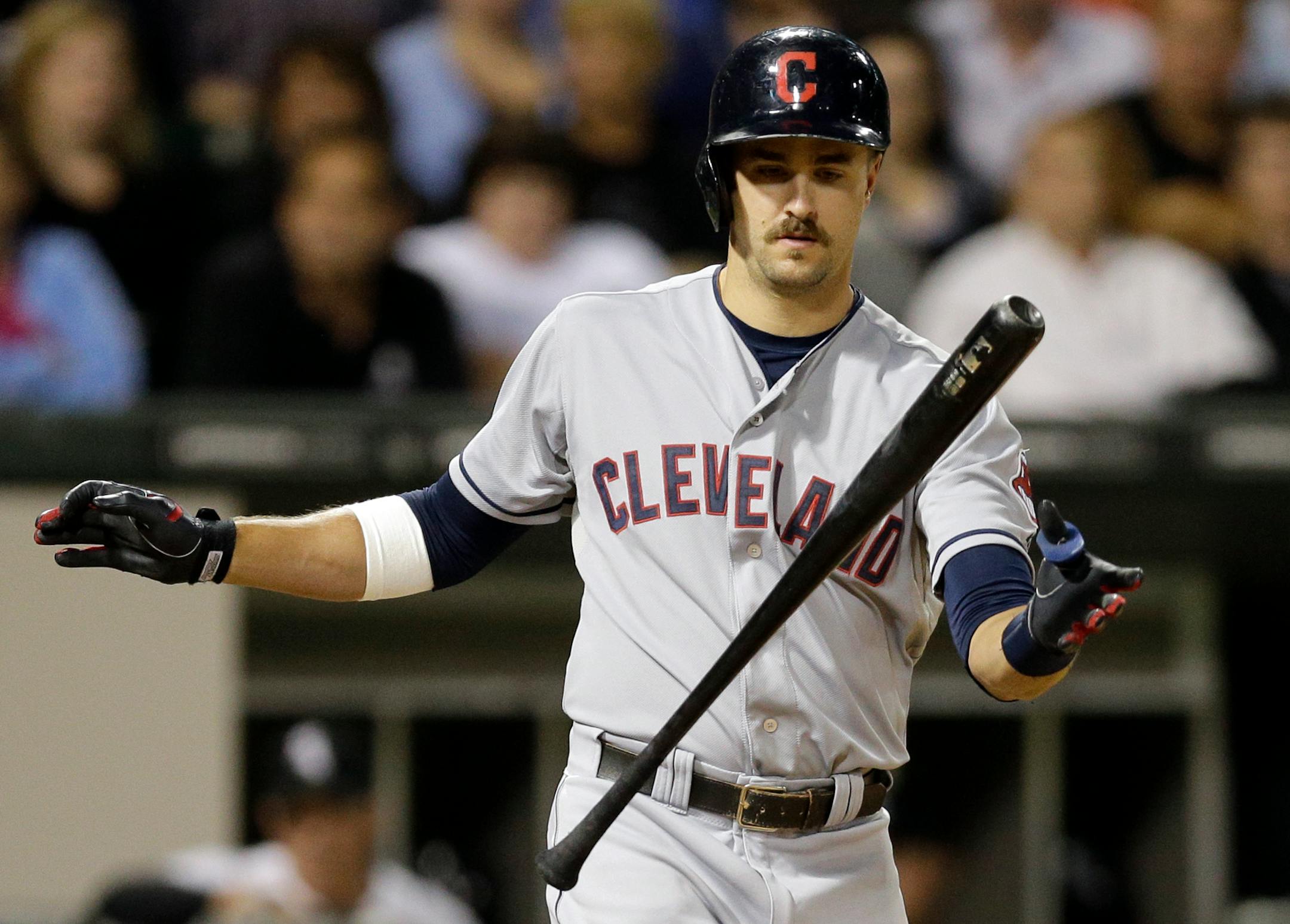 Cleveland Indians' Lonnie Chisenhall (8) tosses his bat after hitting a foul during the ninth inning of a baseball game against the Chicago White Sox in Chicago, Wednesday, Aug. 27, 2014. The White Sox won 3-2. (AP Photo/Nam Y. Huh)