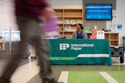 Lucillia Newton, human resources specialist with International Paper, sat at an information table in the lobby of Ramsey County Library in Roseville o