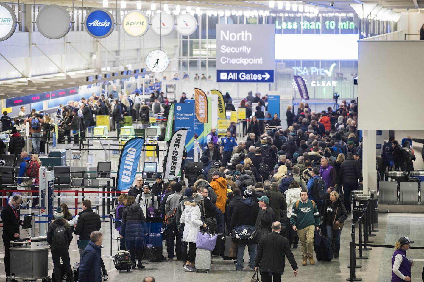 Passengers wait in the security line at Terminal 1. ] LEILA NAVIDI &#xef; leila.navidi@startribune.com BACKGROUND INFORMATION: The scene at MSP Airport Terminal 1 on the morning after the Super Bowl on Monday, February 5, 2018.