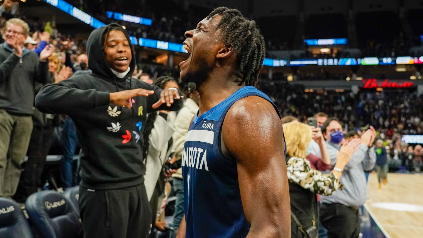 Minnesota Timberwolves guard Anthony Edwards celebrates after defeating the Miami Heat during their NBA basketball game Wednesday, Nov. 24, 2021, in Minneapolis. The Timberwolves won 113-101. (AP Photo/Craig Lassig)