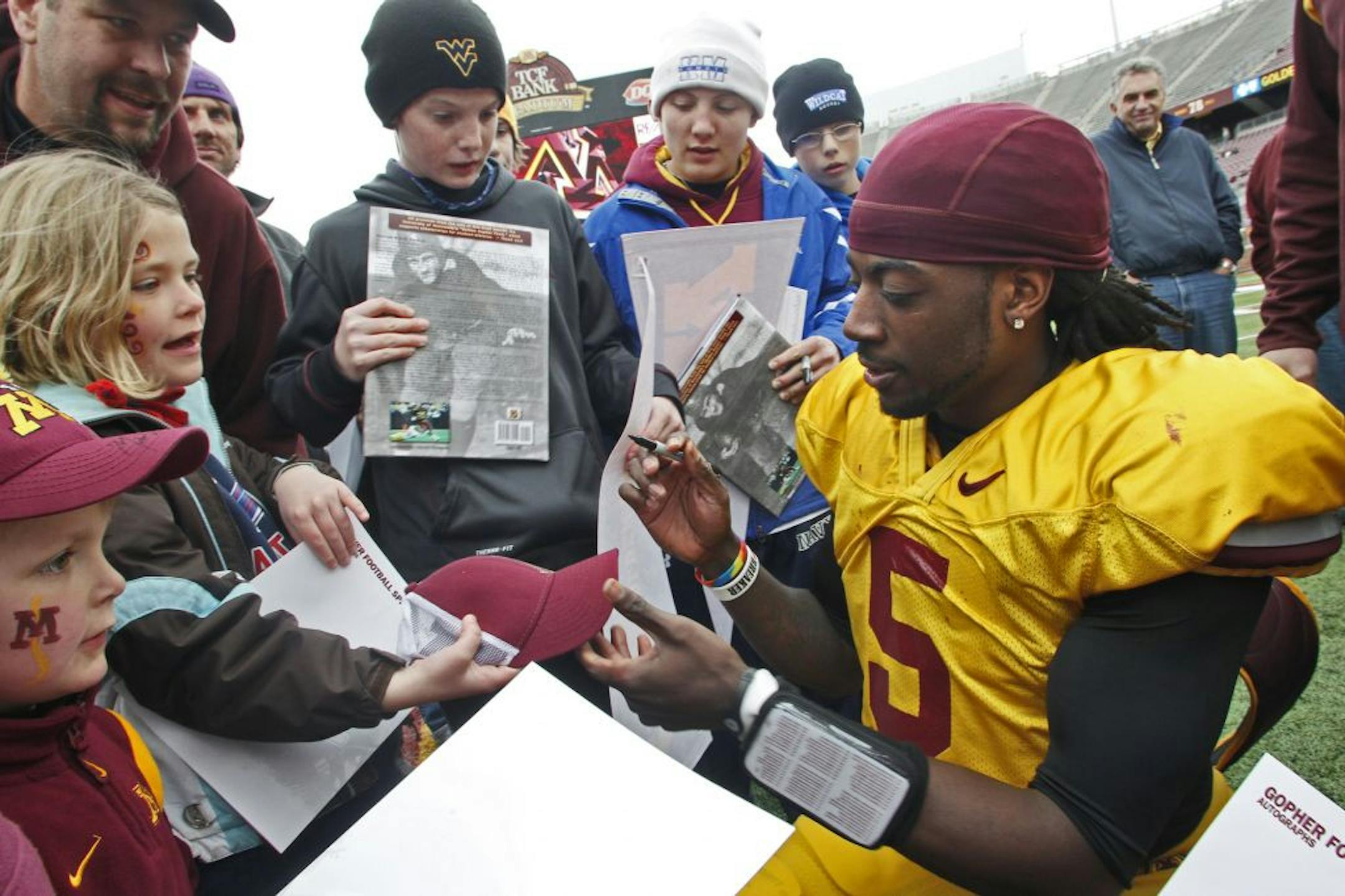 Quarterback MarQueis Gray signed autographs at the end of the game.