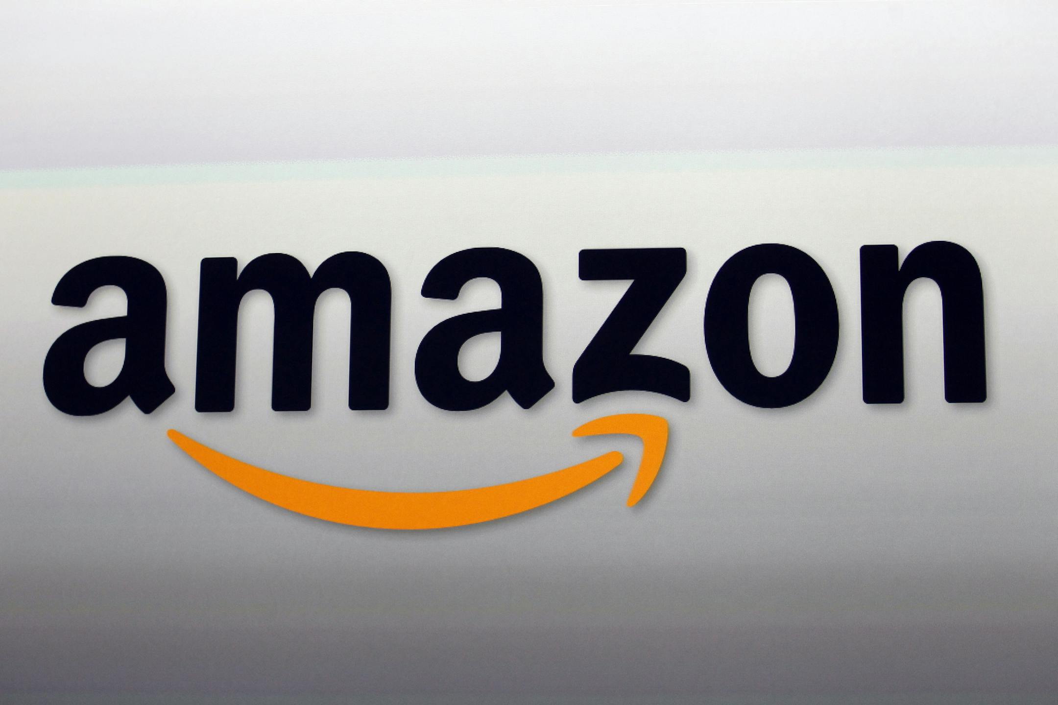 FILE - This Sept. 6, 2012, file photo shows the Amazon logo in Santa Monica, Calif.