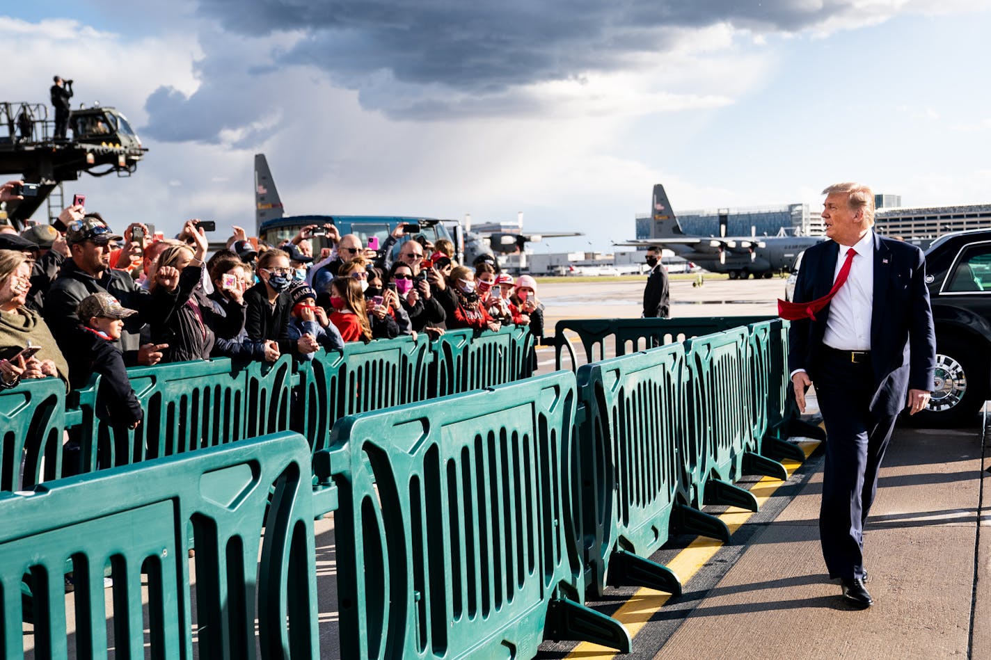 President Donald Trump greeted supporters after arriving at Minneapolis-St. Paul International Airport on Wednesday.