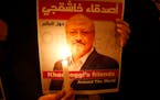 Activists protesting the killing of Saudi journalist Jamal Khashoggi held a candlelight vigil outside Saudi Arabia’s consulate in October 2018 in Is