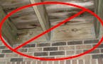 Decks attached through brick veneer