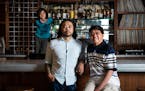 Chef Hai Truong (left) was photographed in his restaurant Ngon Bistro with his dad Tang Truong (right) and his son Khanh Truong, 9, (in background) in