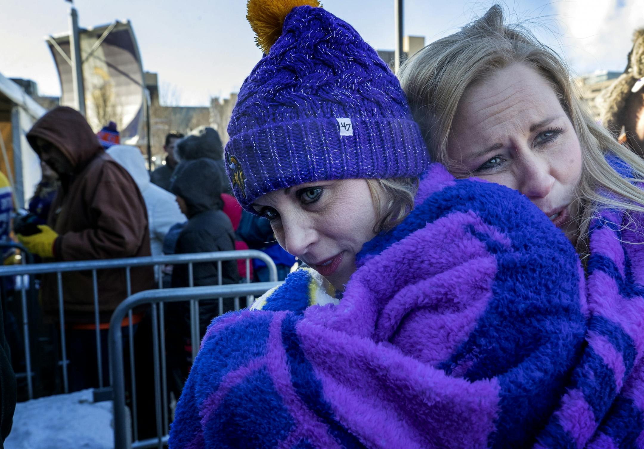 April Nickila and Christina Liesmaki tried to stay warm while waiting in line in -12 temperatures to enter US Bank Stadium to see the Chicago Bears take on the Minnesota Vikings in Minneapolis, MN.