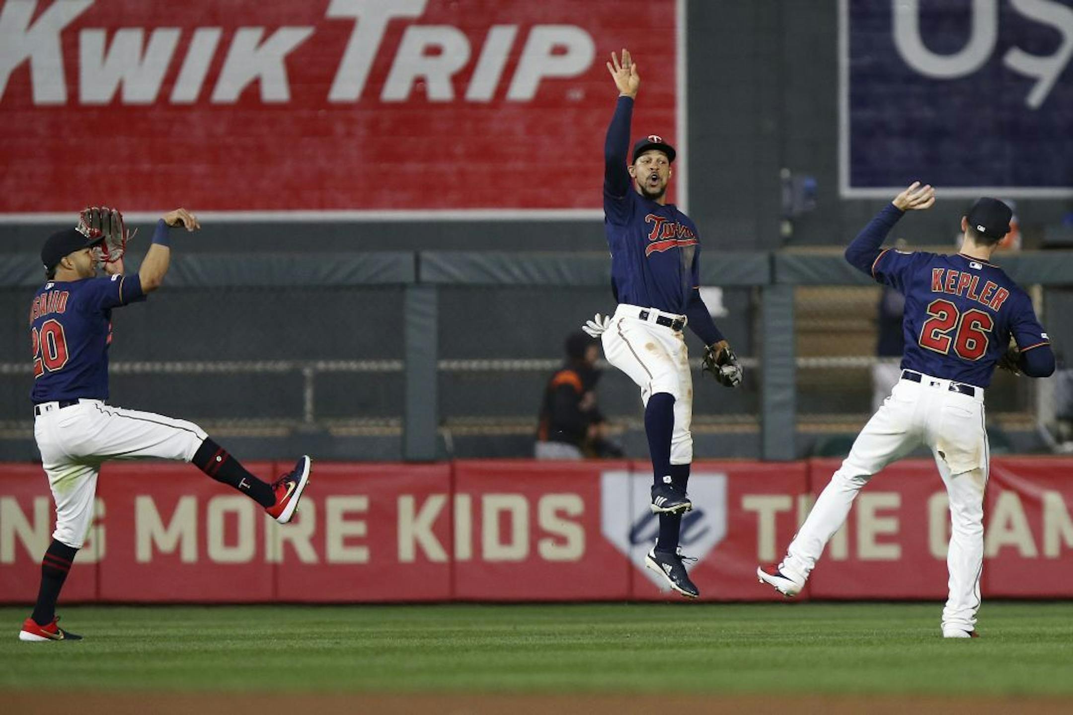 Minnesota Twins' Eddie Rosario, left, Byron Buxton, center, and Max Kepler, right, celebrate on the field after the team's 6-0 win against the Detroit Tigers in a baseball game Friday, May 10, 2019, in Minneapolis.