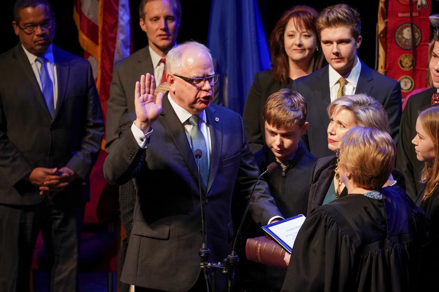 Tim Walz will is sworn in as Minnesota's 41st governor, behind him are constitutional officers Attorney General Keith Ellison, Secretary of State Steve Simon and State Auditor Julie Blaha.