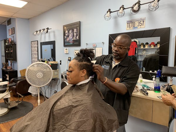 "Get vaccinated. Save a life," said Teto Wilson, owner of Wilson's Image Barbers &amp; Stylists in north Minneapolis, Wilson is one of more than a doz