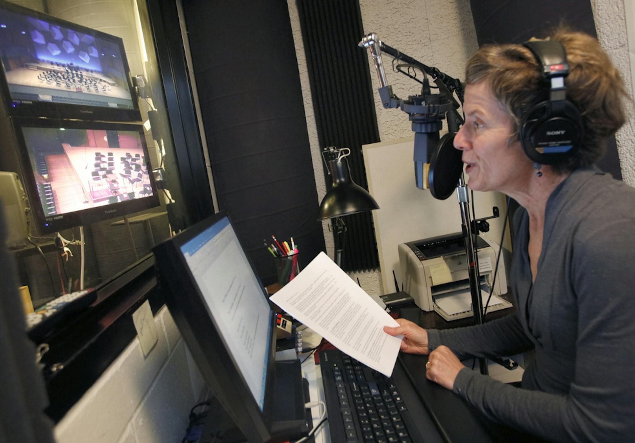 Watching the stage on video monitors in a sound booth at Orchestra Hall, Melissa Ousley prepared for a live broadcast of the Minnesota Orchestra in 2017. (Star Tribune photo by Tom Wallace) ORG XMIT: MIN1710222121107904