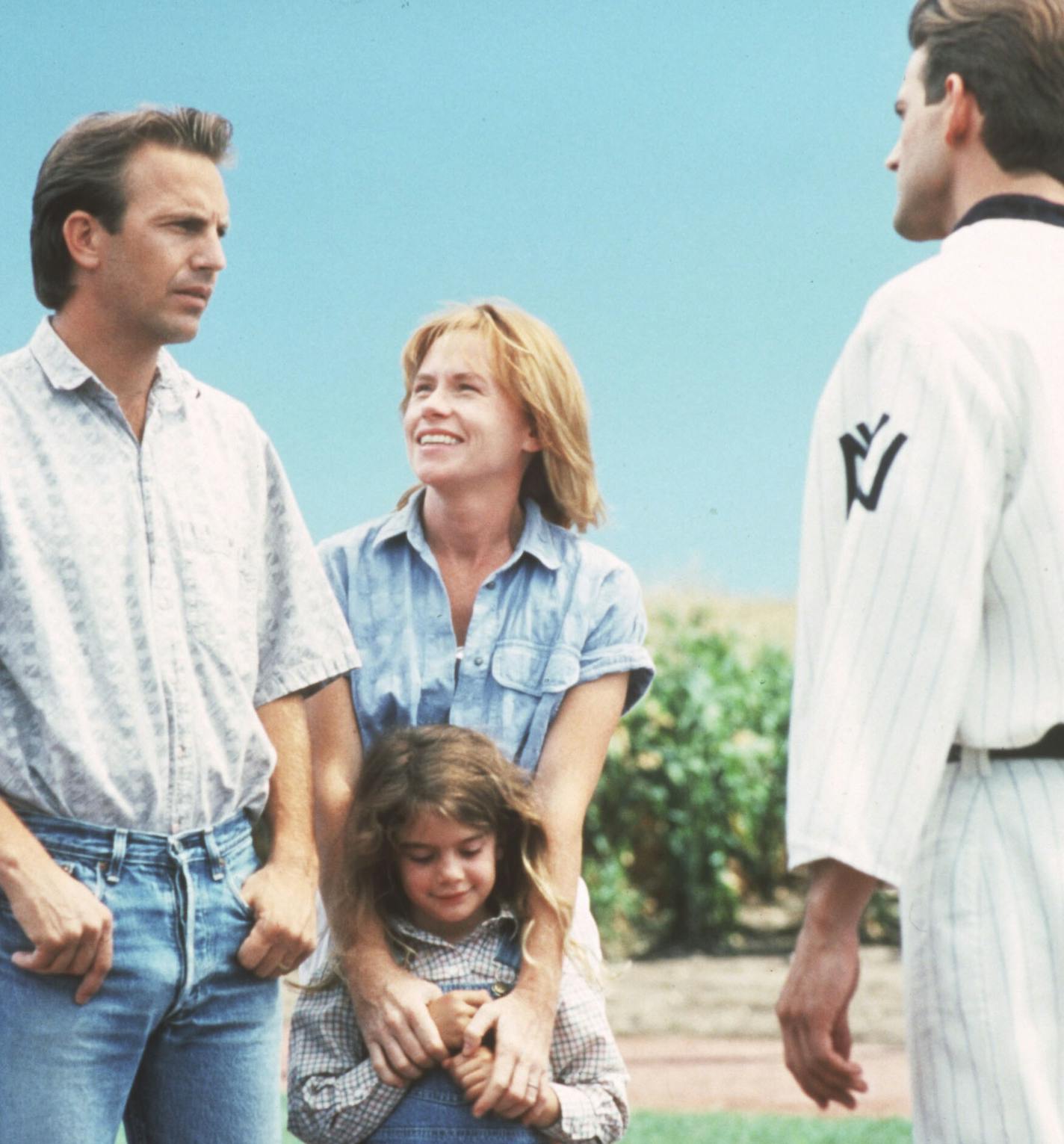 "Field of Dreams" 1989 baseball movie from Universal City Studios. (left to right) Ray Kinsella (played by Kevin Costner), his wife Annie (Amy Madigan), and daughter Karin (Gaby Hoffman), are greeted by a youthful John Kinsella (Dwier Brown), Ray's father. File photo