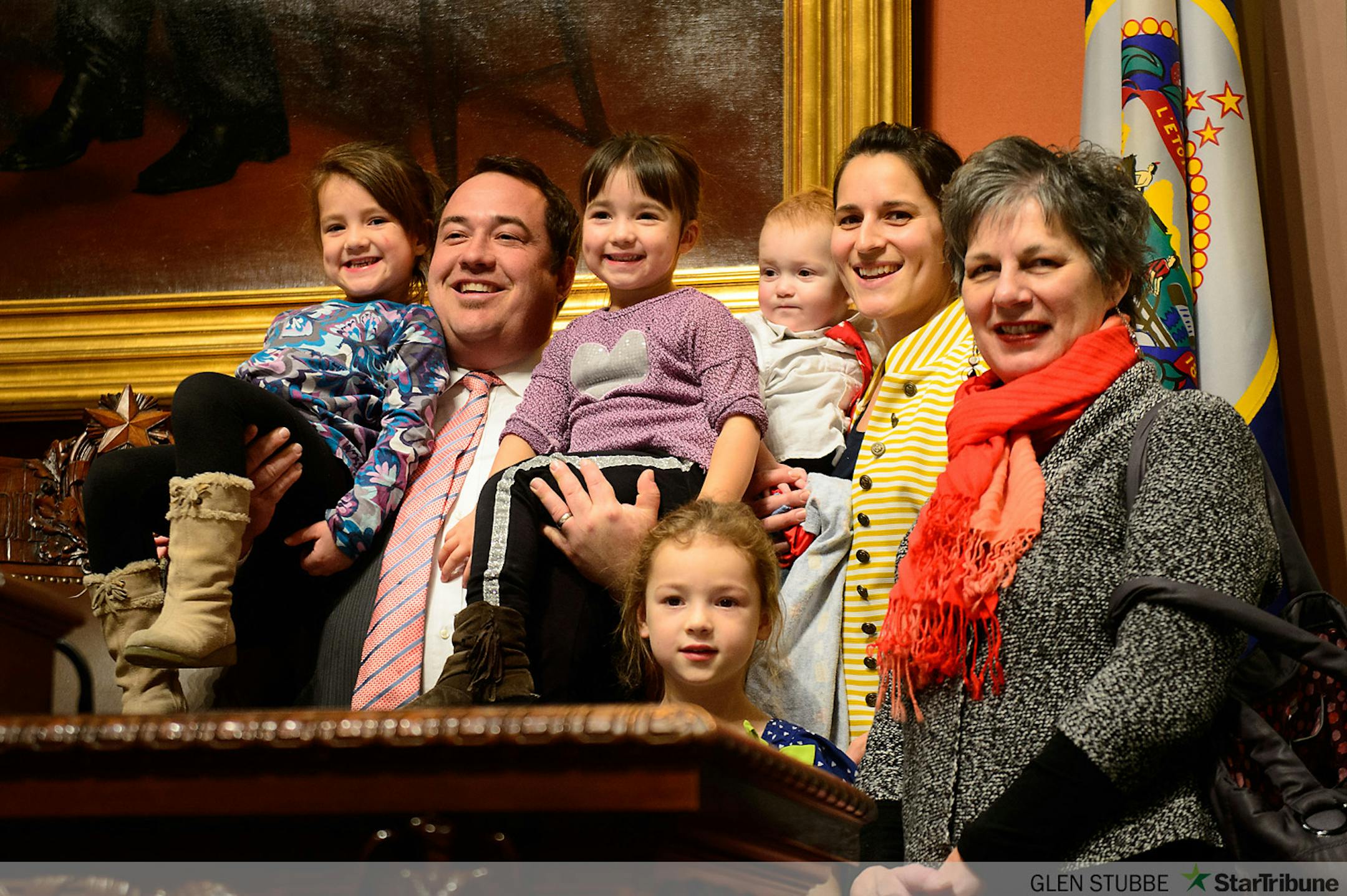 Rep. Chris Swedzinski posed for a photo with his wife Jessica, mother in law Yvonne and his kids Winifred, 6, Hildy, 4, Adeline 3 and Harry 1.    ]   GLEN STUBBE * gstubbe@startribune.com   Tuesday, January 6,  2015  The Minnesota House and Senate re-convene, with much ceremony, family and guests. In the House, Speaker Kurt Daudt will take the gavel back for the GOP.