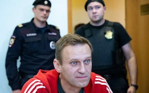 FILE - Russian opposition leader Alexei Navalny speaks to the media prior to a court session in Moscow, on Aug. 22, 2019. Alexei Navalny, the fiercest