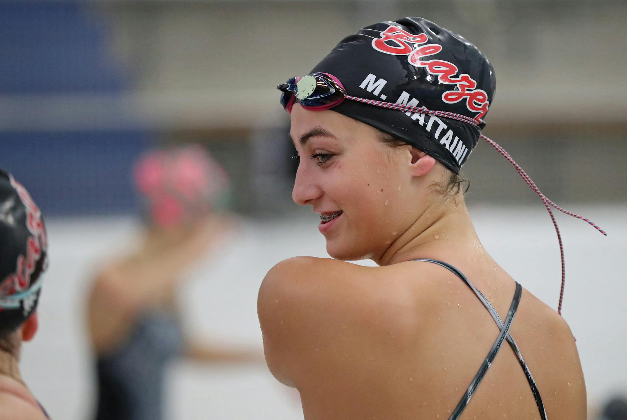 Maria Mattaini stretched out during a practice with the Visitation girls' swimming and diving team.