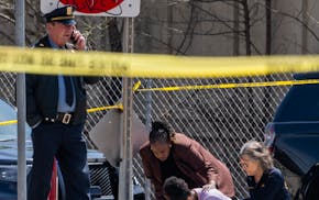 A bystander is shook up by the homicide in front of 2107 Cedar Ave S in Minneapolis on Wednesday. A homicide occurred 2107 Cedar Ave S. before a pres