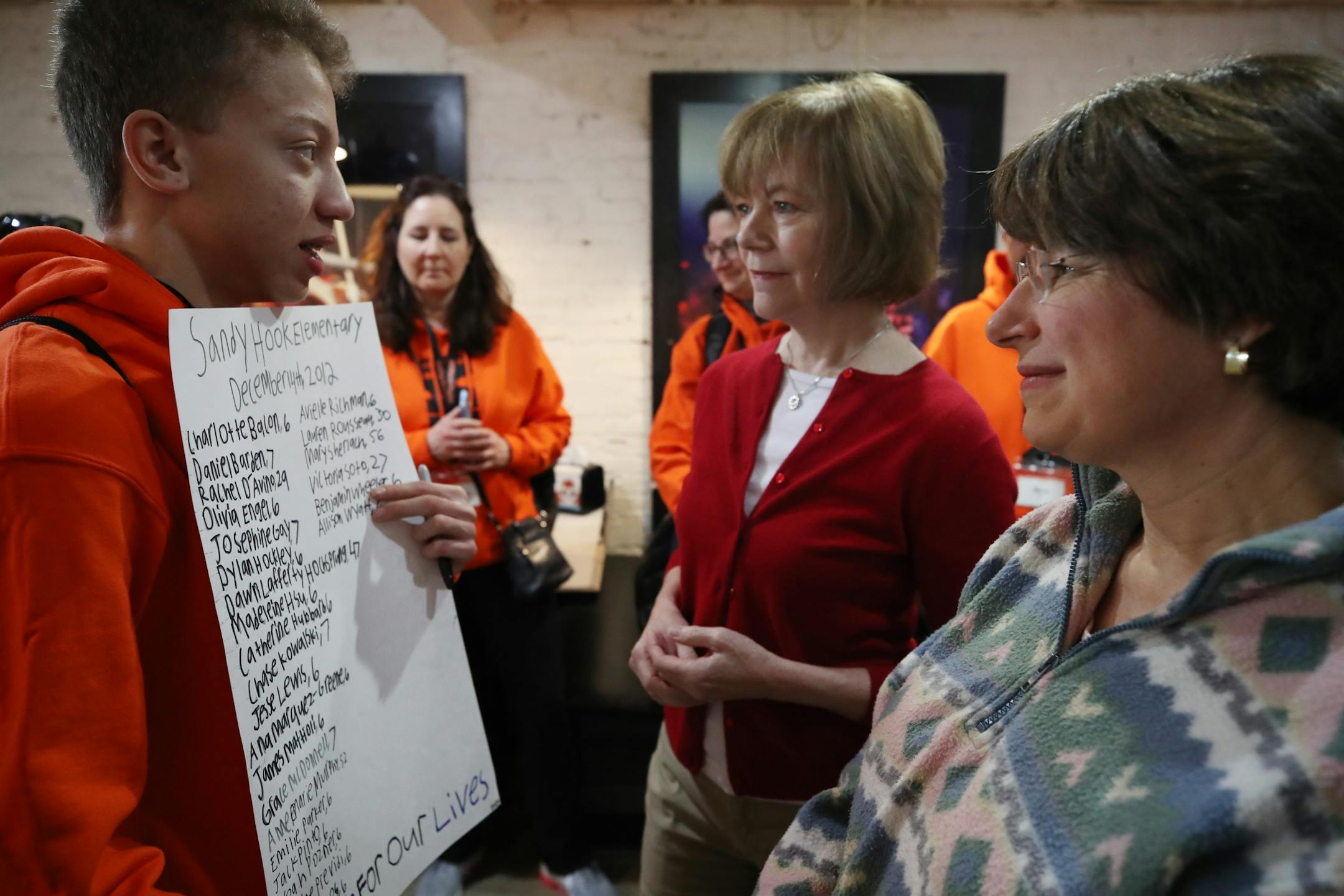 Derek Dean, 15, from Henry Sibley High School talked with Sens. Tina Smith, left, and Amy Klobuchar during a breakfast before he attended the March for Our Lives rally Saturday, March 24, 2018, in Washington, D.C.