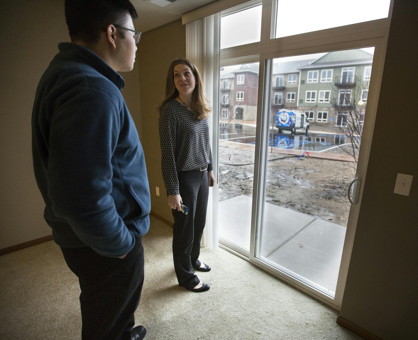 Catherine Ragozzino showed a room to Jefferson Lin at Remington Cove on Wednesday, November 18, 2015, in Apple Valley, Minn. The landscaping has not been completed at this new 101 unit rental facility on Founders Lane. ] RENEE JONES SCHNEIDER &#x2022; reneejones@startribune.com The line from the Mall of America to Apple Valley is the first of many rapid bus lines planned across the metro and other communities are monitoring its success.