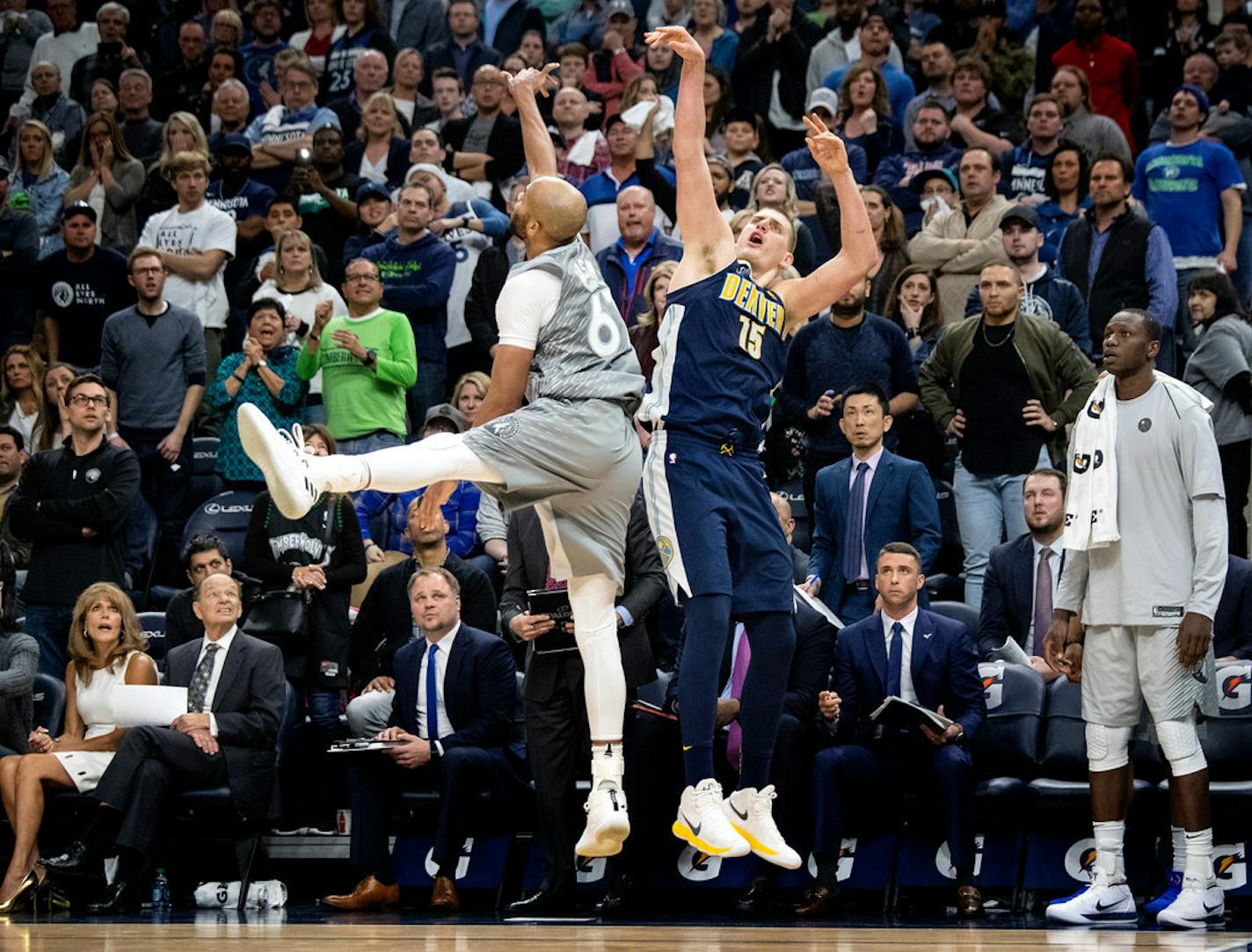 Nikola Jokic (15) was defended by Taj Gibson (67) in the fourth quarter.