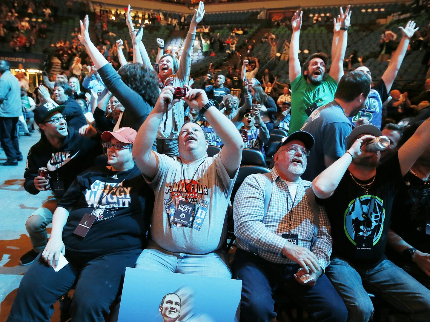 Timberwolves fans Rachael Eggert left and her husband Todd Dombrock cheered after Minnesota was award the first pick in the NBA draft during draft lottery pick party at Target Center Tuesday May 19, 2015 in Minneapolis, MN. ] Jerry Holt/