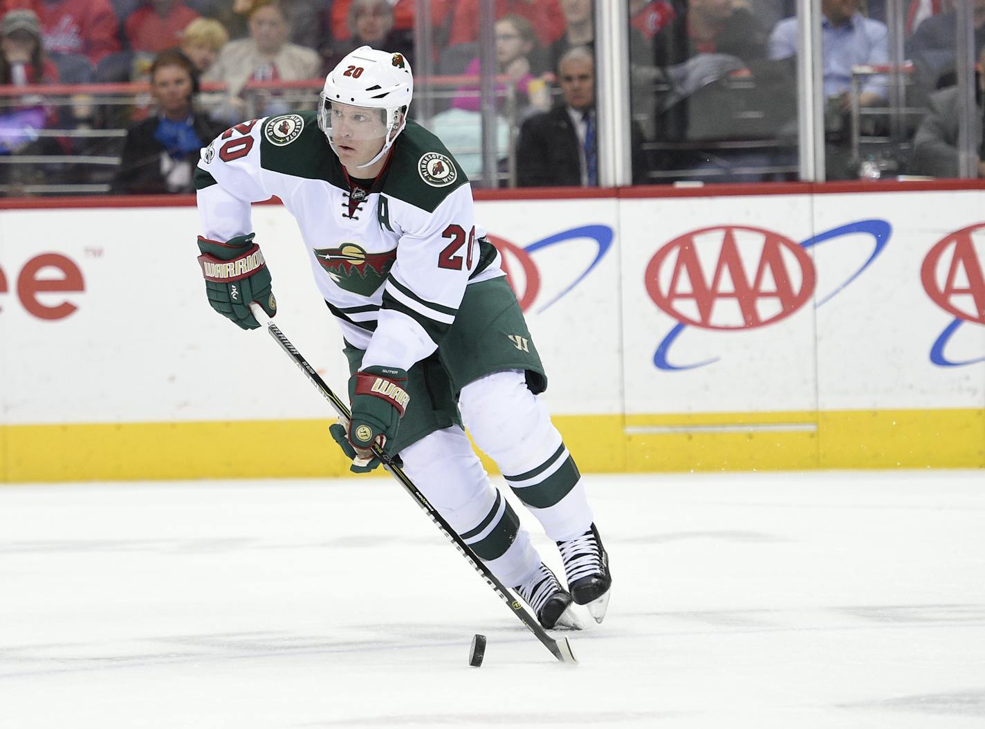 Minnesota Wild defenseman Ryan Suter (20) skates with the puck during the first period of an NHL hockey game against the Washington Capitals, Tuesday, March 14, 2017, in Washington. (AP Photo/Nick Wass) ORG XMIT: VZN10