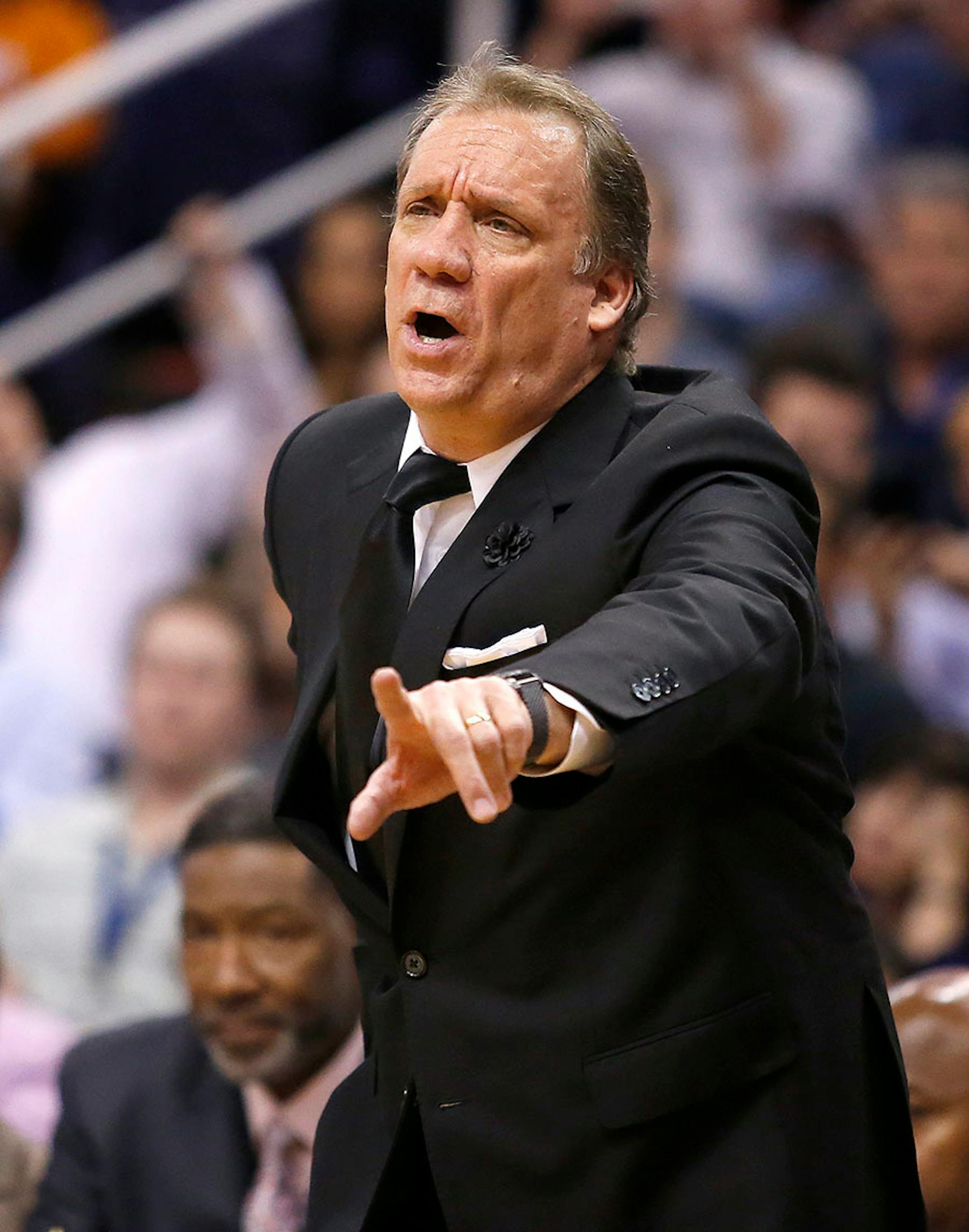 Minnesota Timberwolves coach Flip Saunders calls out a foul against the Phoenix Suns during the second quarter of an NBA basketball game, Wednesday, March 11, 2015, in Phoenix.
