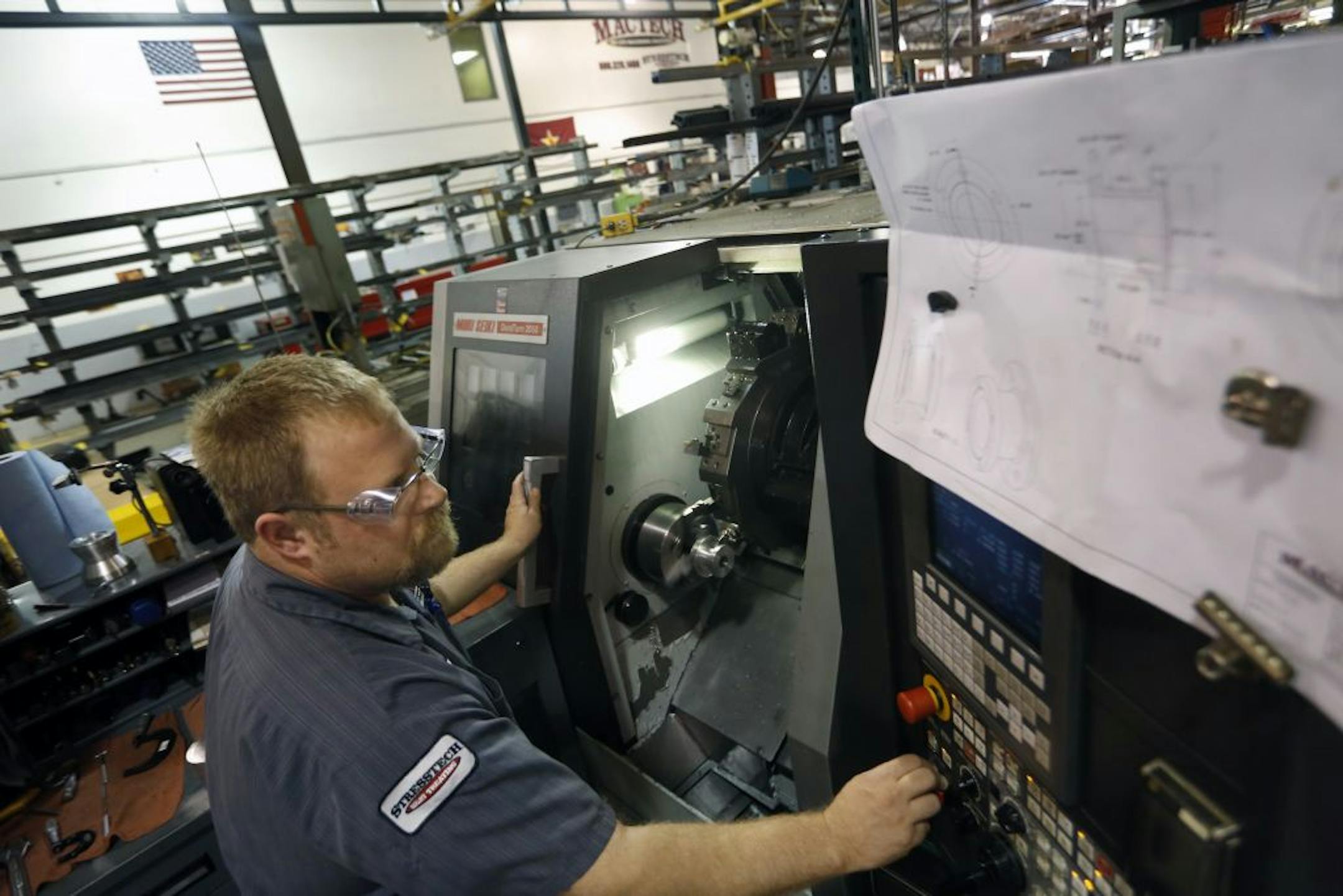 At Mactech, an international firm that builds, sells and rents tools that cut and bevel pipes, machinist Cale Swanson uses a CNC (computer numerical control) lathe programmed to create one of two unique flanges for a machine part.