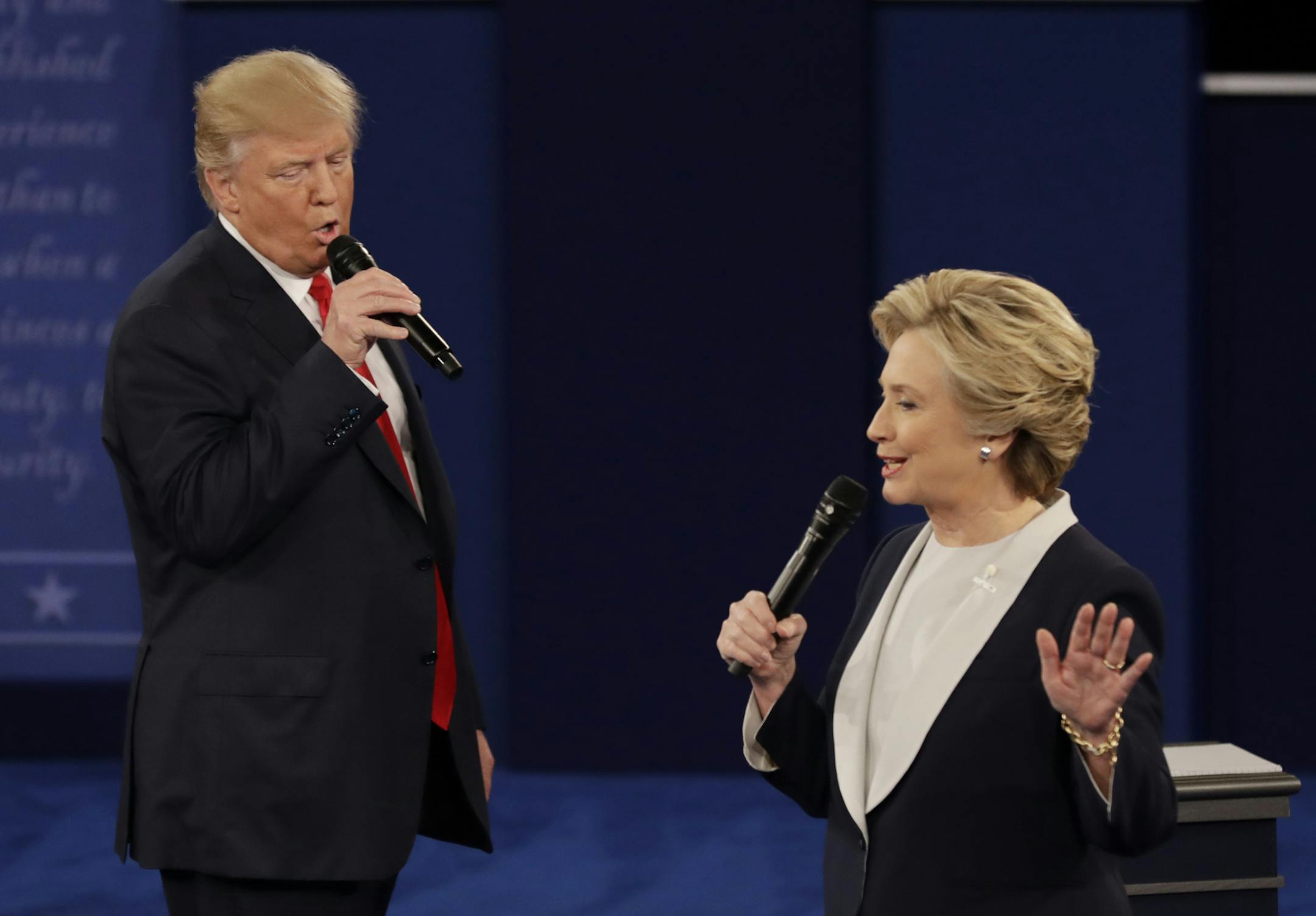 Republican presidential nominee Donald Trump and Democratic presidential nominee Hillary Clinton speak during the second presidential debate at Washington University in St. Louis, Sunday, Oct. 9, 2016. (AP Photo/Patrick Semansky)