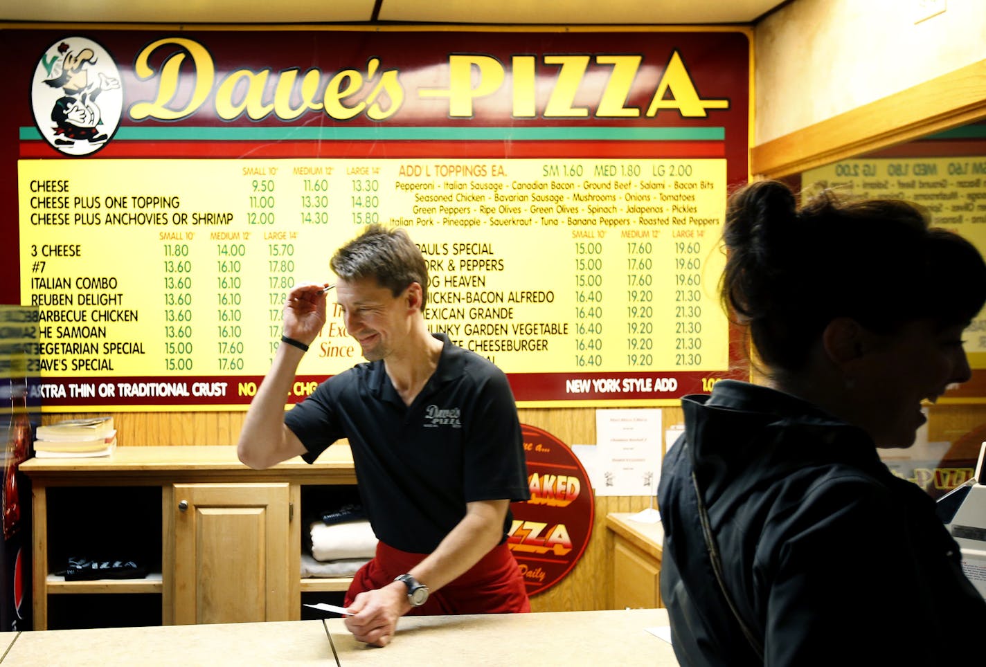 Pete Fenson took an order at Dave's Pizza. Fenson owns Dave's Pizza in Bemidji, Minn. Fenson and his team won a Bronze medal in the 2006 Winter Olympics. It was the first Olympic medal for the United States in curling. ] CARLOS GONZALEZ cgonzalez@startribune.com November 6, 2013, Bemidji, Minn., - Olympic Curler Pete Fenson &#x201a;&#xc4;&#xec; owner of Dave&#x201a;&#xc4;&#xf4;s Pizza