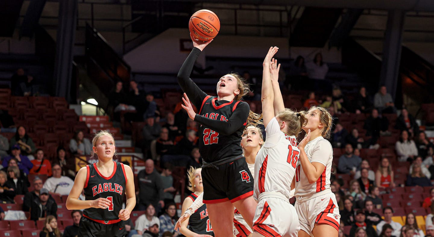 Eden Prairie's Ashley Fritz broke free from a pack of Centennial defenders to score in the second half of the Eagles' 78-57 quarterfinal victory at Williams Arena. Class 4A girls basketball state tournament quarterfinal, Eden Prairie vs. Centennial, 3-15-23. Photo by Mark Hvidsten, SportsEngine