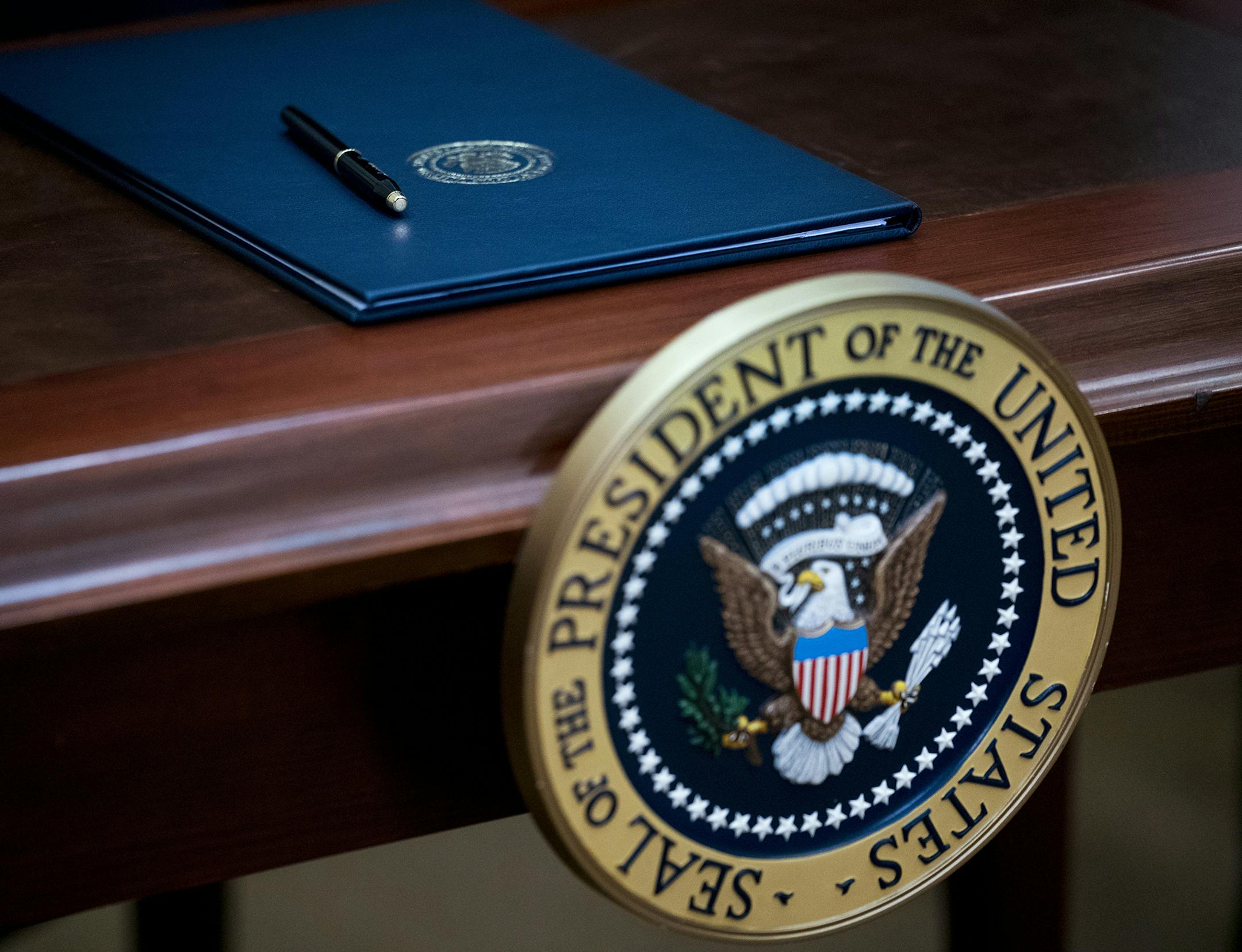 A desk with the presidential seal and an executive order for the "Apprenticeship and Workforce of Tomorrow" program, during a signing event with President Donald Trump in the Roosevelt Room of the White House, in Washington, June 15, 2017. Trump&#xed;s action aims to expand federally funded apprenticeship programs. (Doug Mills/The New York Times) ORG XMIT: MIN2017072512244438 ORG XMIT: MIN1707251228435793