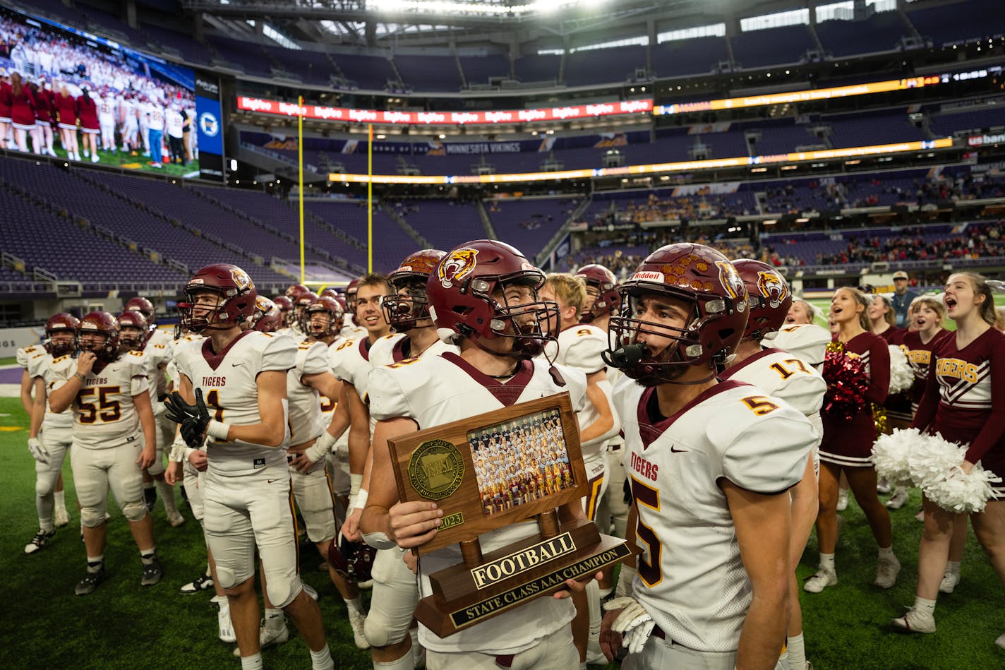 Stewartville players celebrate with their trophy after defeating Annandale in the state Class 3A championship football game at U.S. Bank Stadium in Minneapolis, Minn., on Saturday, Nov. 25, 2023. ] SHARI L. GROSS • shari.gross@startribune.com