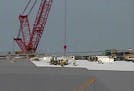 A MnDOT traffic camera appears to capture the rescue happening on the roof of the new Vikings stadium on Wednesday, Aug. 26, 2015.