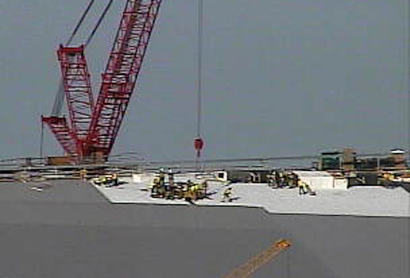 A MnDOT traffic camera appears to capture the rescue happening on the roof of the new Vikings stadium on Wednesday, Aug. 26, 2015.