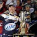 Brad Keselowski celebrates in Victory Lane with the trophy after winning the NASCAR Sprint Cup Series auto race at Charlotte Motor Speedway in Concord