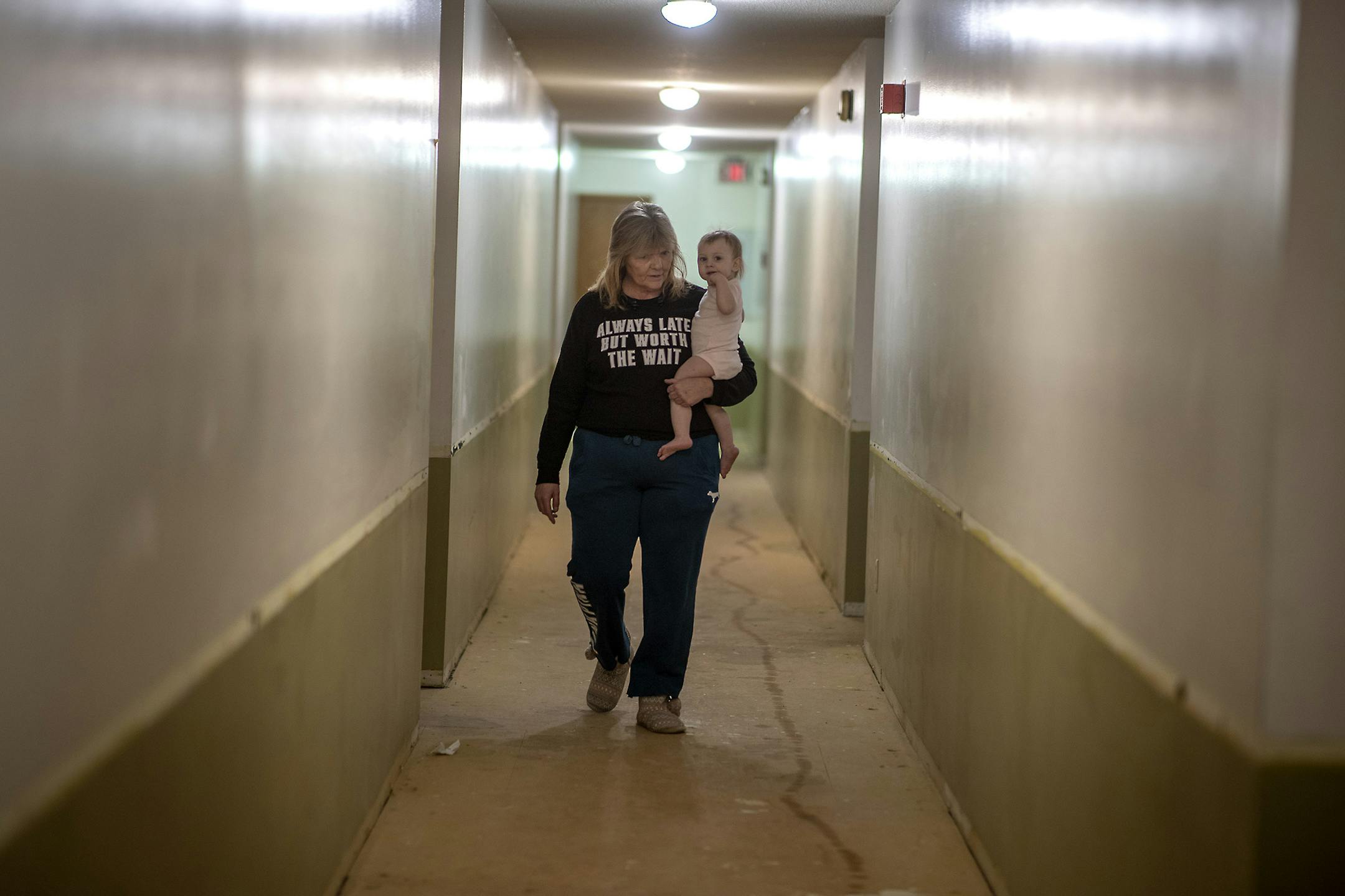 Michelle Doran, who babysat 16-month-old Maddielynn, cq, walked down her hallway where construction is being done in the complex, Wednesday, January 29, 2020 in New Brighton, MN. ] ELIZABETH FLORES &#x2022; liz.flores@startribune.com