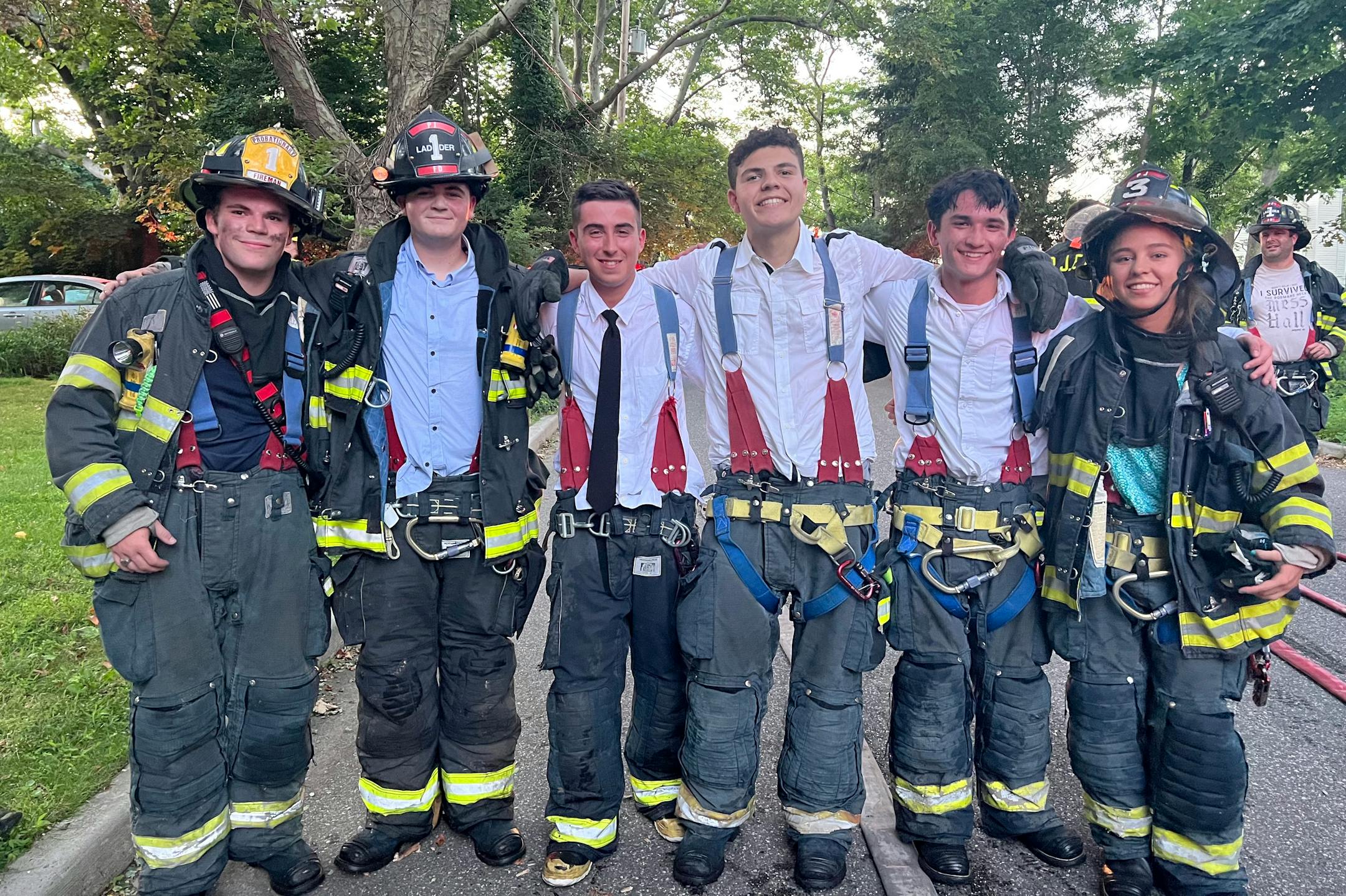 Senior students at Port Jefferson High School, who left their graduation early to put out a fire. From left, Shane Hartig, Ryan Parmegiani, Peter Rizzo, Hunter Volpi, Andrew Patterson and Kasumi Layne-Stasik. MUST CREDIT: Port Jefferson Fire Department